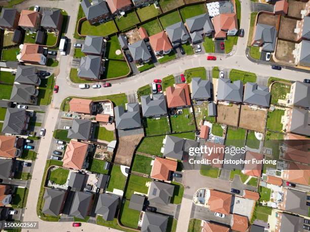 An aerial view of new homes on a construction development site on June 22, 2023 in Nantwich, England. The Bank of England has increased the base rate...