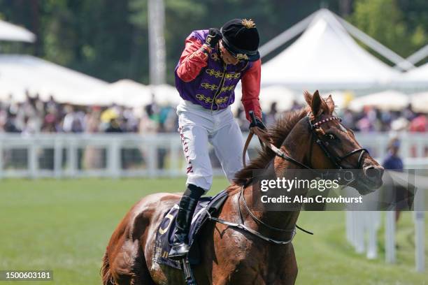 Tom Marquand celebrates after riding Desert Hero to win The King George V Stakes on day three during Royal Ascot 2023 at Ascot Racecourse on June 22,...