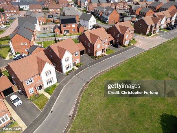 An aerial view of new houses are seen on a construction development on June 22, 2023 in Crewe, England. The Bank of England has increased the base...