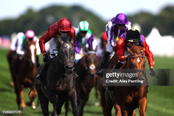 Desert Hero ridden by Tom Marquand (and owned by King Charles III and Queen Camilla crosses the line to win the King George V Stakes during day three...