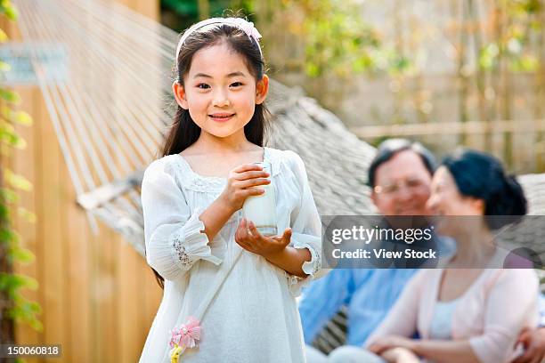 girl playing with her grandparents - retiremen stock pictures, royalty-free photos & images