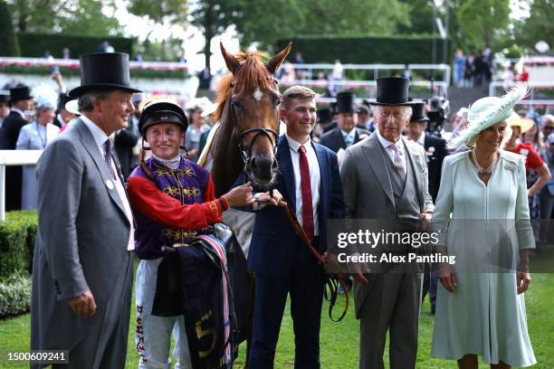 Desert Hero ridden by Tom Marquand with owners HM the King and HM The Queen after The King George V Stakes during day three of Royal Ascot 2023 at...