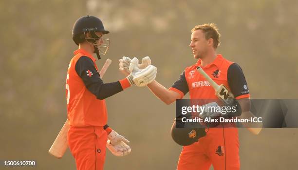 Scott Edwards and Logan van Beek of the Netherlands celebrate following the ICC Men's Cricket World Cup Qualifier Zimbabwe 2023 match between the...