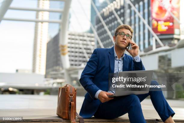 manager with laptop and smart phone - government building steps stock pictures, royalty-free photos & images