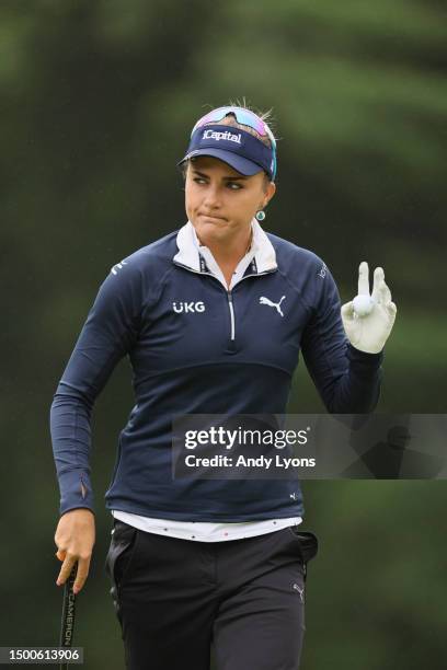 Lexi Thompson of the United States acknowledges fans after a putt on the eighth greenduring the first round of the KPMG Women's PGA Championship at...