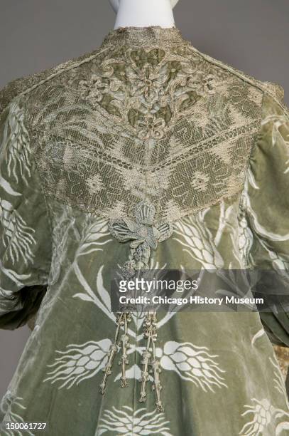 Bertha Palmer's evening coat, ca 1902 . Silk satin with cut velvet in wheat pattern, metallic thread lace, silk metallic tassels by Worth. Bertha...