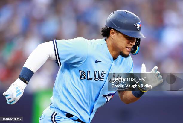 Santiago Espinal of the Toronto Blue Jays runs to first base against the Houston Astros at Rogers Centre on June 06, 2023 in Toronto, Ontario, Canada.