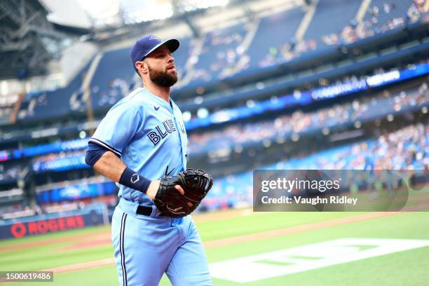 Brandon Belt of the Toronto Blue Jays runs to the dugout prior to a game against the Houston Astros at Rogers Centre on June 06, 2023 in Toronto,...