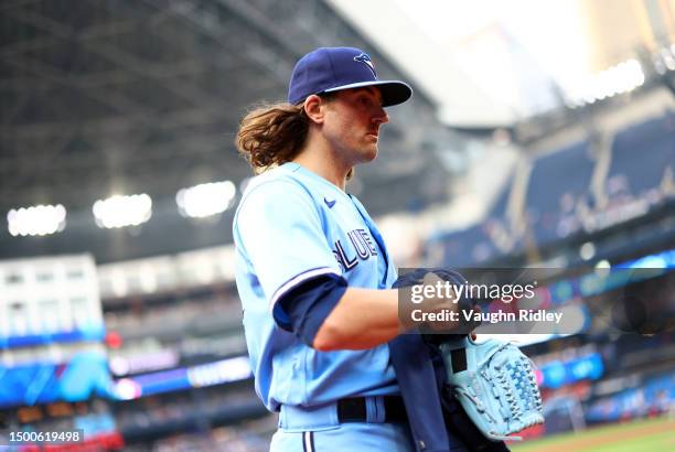 Kevin Gausman of the Toronto Blue Jays walks to the dugout prior to a game against the Houston Astros at Rogers Centre on June 06, 2023 in Toronto,...