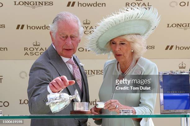 Owners King Charles III and Queen Camilla prior to the presentation of the trophy for the King George V Stakes on day three during Royal Ascot 2023...