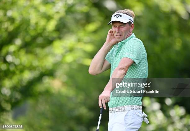 Marcel Siem of Germany reacts after putting on the 14th green during Day One of the BMW International Open at Golfclub Munchen Eichenried on June 22,...