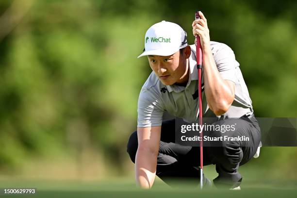 Haotong Li of China prepares to putt on the 14th green during Day One of the BMW International Open at Golfclub Munchen Eichenried on June 22, 2023...
