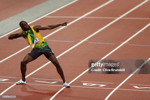 Usain Bolt of Jamaica celebrates after winning gold in the Men's 200m Final on Day 13 of the London 2012 Olympic Games at Olympic Stadium on August...