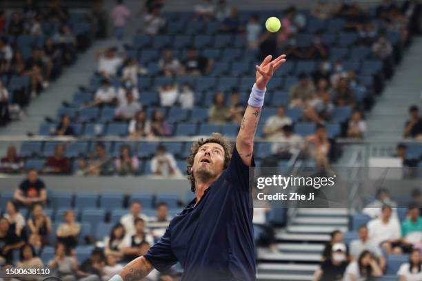 Marat Safin of Russia serves against Carlos Moya of Spain and Juan Martin Del Potro of Argentina on Day 1 of Hangzhou 2023 International Tennis...