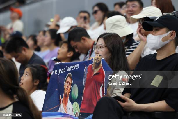 Supporters of Russia's Marat Safin cheer for him during the Hangzhou 2023 International Tennis Masters Tournament at Hangzhou Olympic And...
