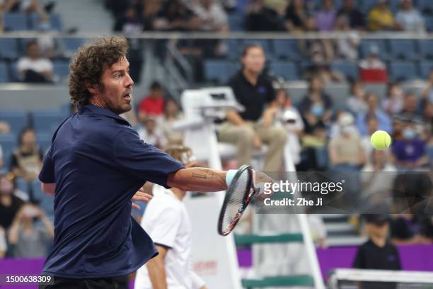 Marat Safin of Russia returns a shot against Carlos Moya of Spain and Juan Martin Del Potro of Argentina on Day 1 of Hangzhou 2023 International...