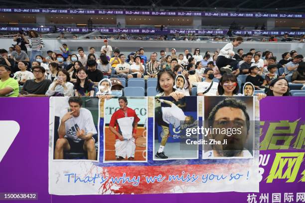 Supporters of Russia's Marat Safin cheer for him during the Hangzhou 2023 International Tennis Masters Tournament at Hangzhou Olympic And...