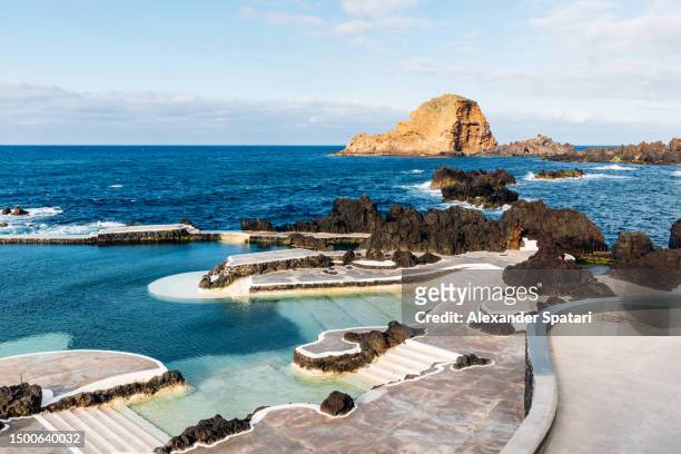 natural pool among rocks in porto moniz, madeira island, portugal - funchal imagens e fotografias de stock