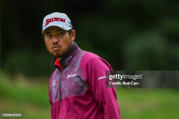 Hideki Matsuyama of Japan looks on from the 14th green during the first round of the Travelers Championship at TPC River Highlands on June 22, 2023...