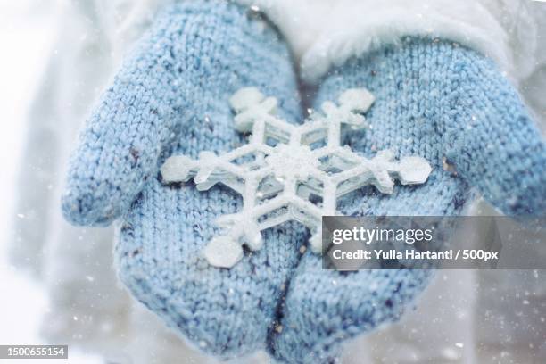 ornament snowflake in the hand - snow flakes stock pictures, royalty-free photos & images