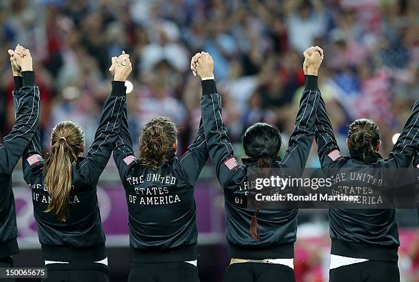 The United States women's soccer team celebrates with the the gold medal after defeating Japan by a score of 2-1 to win the Women's Football gold...