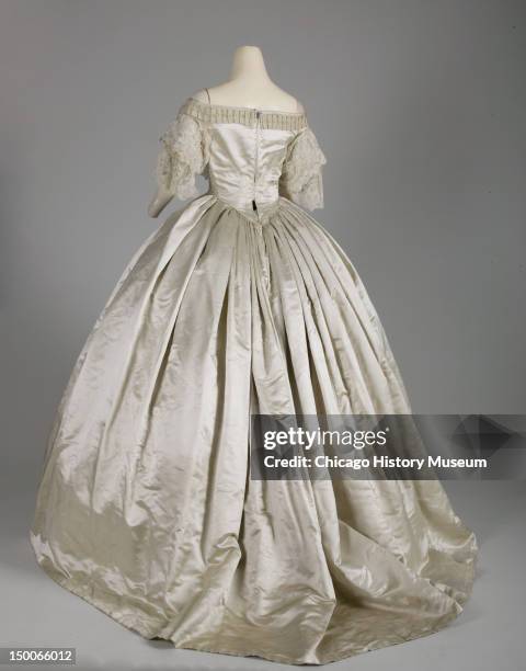 Evening dress, 1861 . Silk satin, silk ribbon, hand-made point de gaze lace, attributed to Worth & Bobergh.