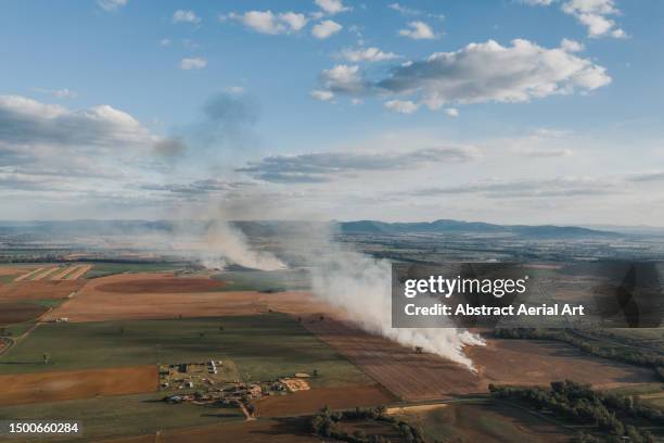 aerial image showing a permit burn on a farm in a rural area, new south wales, australia - kontrolliertes abbrennen stock-fotos und bilder