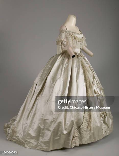 Evening dress, 1861 . Silk satin, silk ribbon, hand-made point de gaze lace, attributed to Worth & Bobergh.