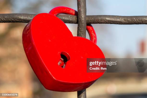 red padlock in the shape of a heart - love padlocks stock pictures, royalty-free photos & images