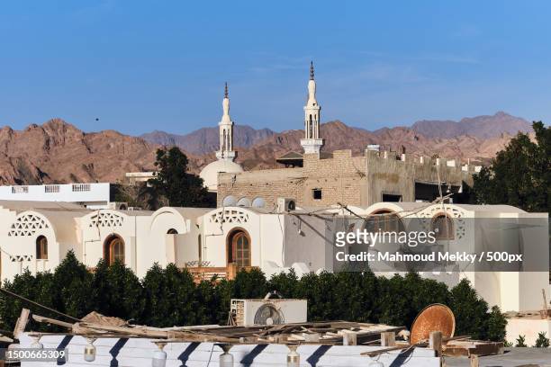 view of buildings against blue sky,dahab,south sinai governorate,egypt - tourism in south sinai stock pictures, royalty-free photos & images