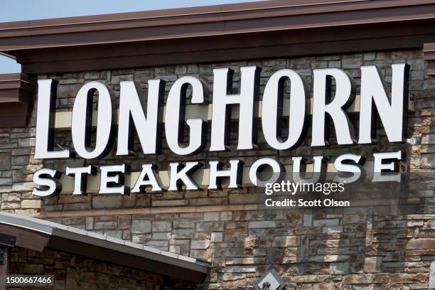 Sign marks the location of a LongHorn Steakhouse restaurant on June 22, 2023 in Skokie, Illinois. Darden Restaurants, the parent company of LongHorn...