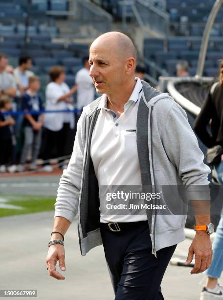 New York Yankees general manager Brian Cashman looks on during batting practice before a game between the Yankees and the Seattle Mariners at Yankee...