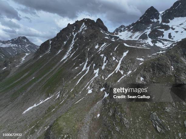 In this aerial view mountains stand at the end of Jamtal valley, near the site of the Fluchthorn rockslide, on June 22, 2023 near Galtur, Austria. On...