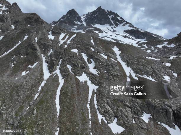 In this aerial view mountains stand at the end of Jamtal valley, near the site of the Fluchthorn rockslide, on June 22, 2023 near Galtur, Austria. On...