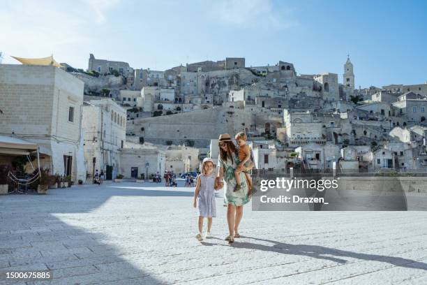 family with kids traveling and enjoying city break in matera, family enjoying in southern italy in region basilicata - basilicata region stock pictures, royalty-free photos & images