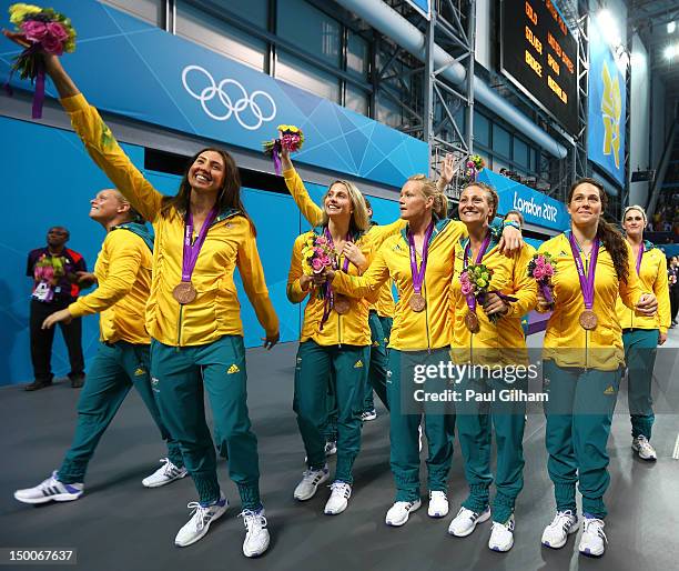 Bronze medallists Australia celebrate following the medal ceremony for the Women's Water Polo on Day 13 of the London 2012 Olympic Games at the Water...