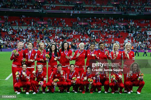 Team Canada stands on the podium with the the bronze medal after Women's Football gold medal match on Day 13 of the London 2012 Olympic Games at...