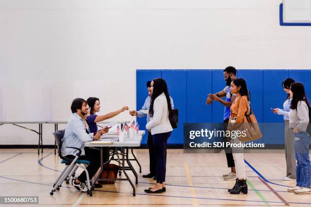 diverse people wait in line to receive their ballots - student government stock pictures, royalty-free photos & images