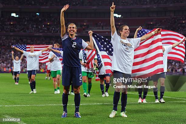 Heather Mitts and Kelley O'Hara of United States celebrate their 2-1 gold medal victory over Japan during the Women's Football gold medal match on...
