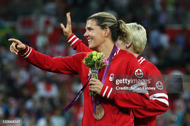 Christine Sinclair of Canada celebrates after receiving the bronze medal after the Women's Football gold medal match on Day 13 of the London 2012...