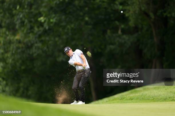 Robert Streb of the United States plays a second shot on the 14th hole during the first round of the Travelers Championship at TPC River Highlands on...