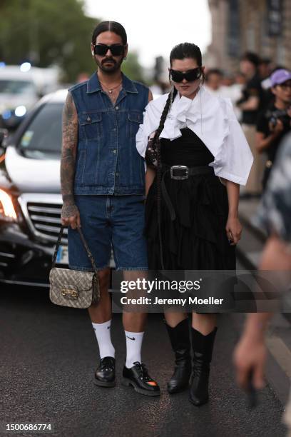 Fashion Week guest is seen wearing black shades, denim vest and matching jeans shorts, Gucci x Balenciaga Horsebit logo beige bag, Nike white socks...