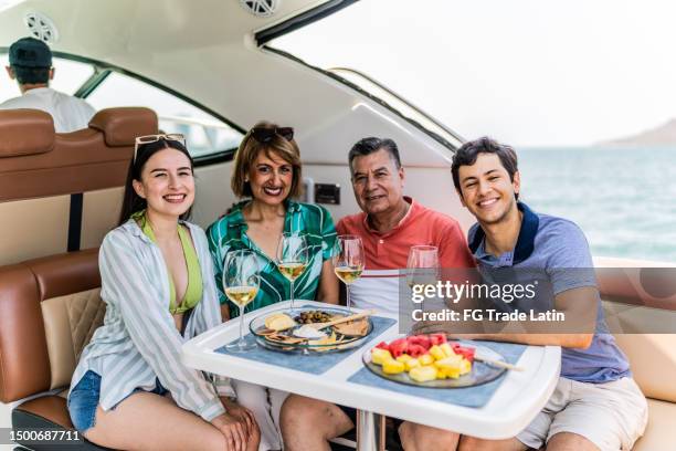 portrait of family during a yacht trip - pacific_plate stock pictures, royalty-free photos & images