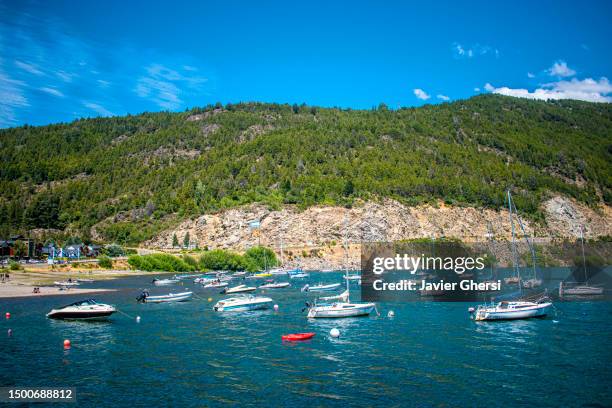 lake lacar, beach and boats. san martin de los andes, neuquen, argentina. - argentina beach stock pictures, royalty-free photos & images