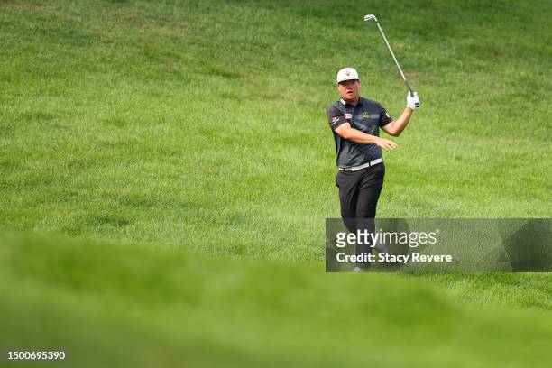 Sungjae Im of Korea reacts to his approach on the 14th hole during the first round of the Travelers Championship at TPC River Highlands on June 22,...