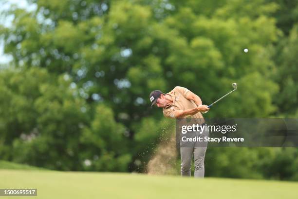 Viktor Hovland of Norway plays an approach shot on the 14th hole during the first round of the Travelers Championship at TPC River Highlands on June...