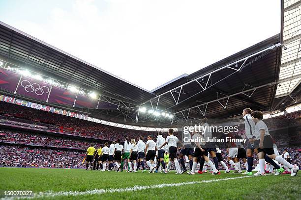 The United State team takes the field to take ok Japan in the Women's Football gold medal match on Day 13 of the London 2012 Olympic Games at Wembley...