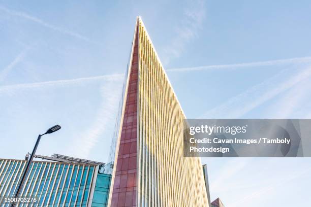 modern business buildings and victoria theater by the victoria station - kingdom of england stock pictures, royalty-free photos & images