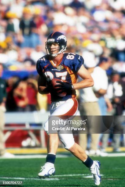 Wide Receiver Ed McCaffrey of the Denver Broncos makes a catch in the Super Bowl XXXII game between the Green Bay Packers v the Denver Broncos on...