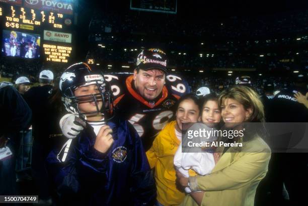 Guard Mark Schlereth of the Denver Broncos celebrates with his family after the Super Bowl XXXII game between the Green Bay Packers v the Denver...
